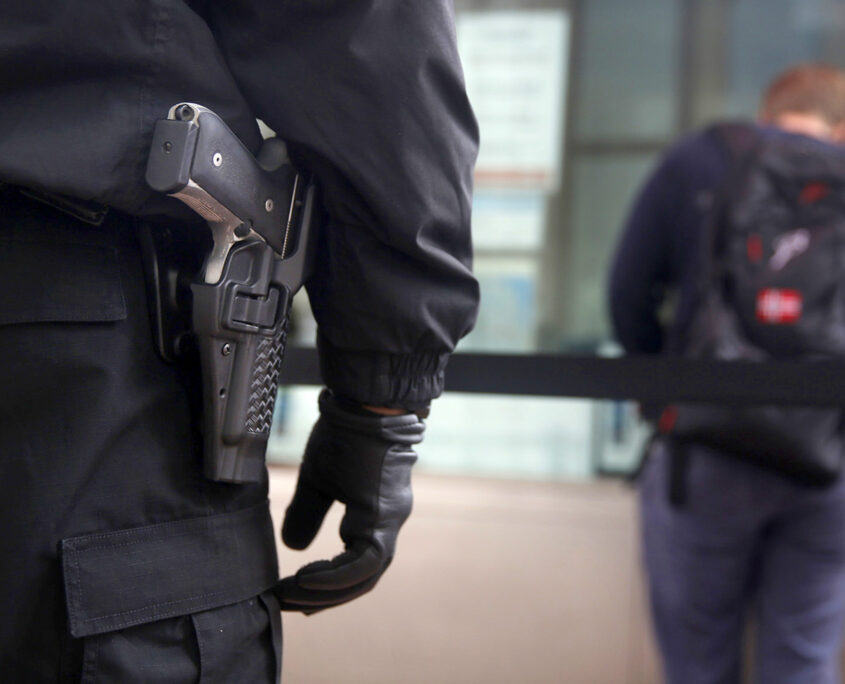 Kasayle Howard (left), armed security guard with Cypress Security, stands next to the cable car fare kiosk while working at Powell and Market Streets on Monday, April 20, 2015 in San Francisco, Calif.